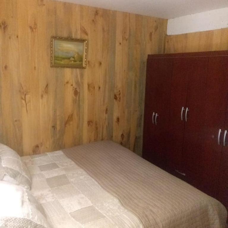 Postel nebo postele na pokoji v ubytování Hostal Maitahue