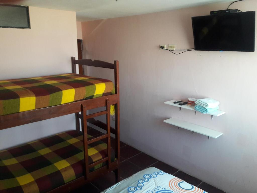 Postel nebo postele na pokoji v ubytování Hostal Haziel