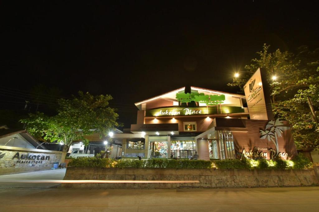 a building with lights in front of it at night at Aukotan Place in Ko Tao