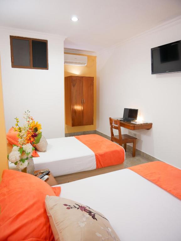 Postel nebo postele na pokoji v ubytování Hostal España