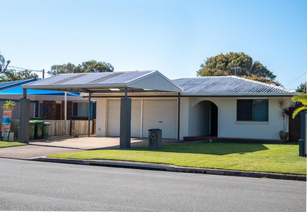 a house with a solar roof on a street at Michael Street 39 Golden Beach in Caloundra