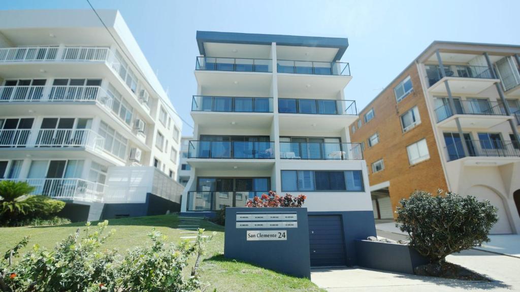 an apartment building with a sign in front of it at San Clemente 3 24 Orvieto Tce in Caloundra