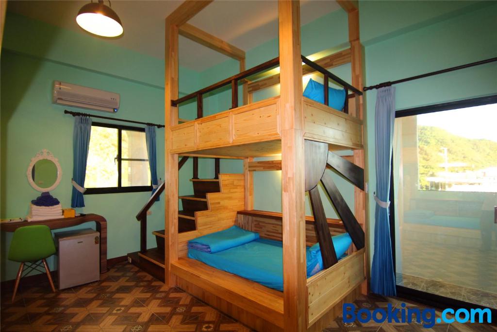 Postel nebo postele na pokoji v ubytování Lian Chinq Diving B&B