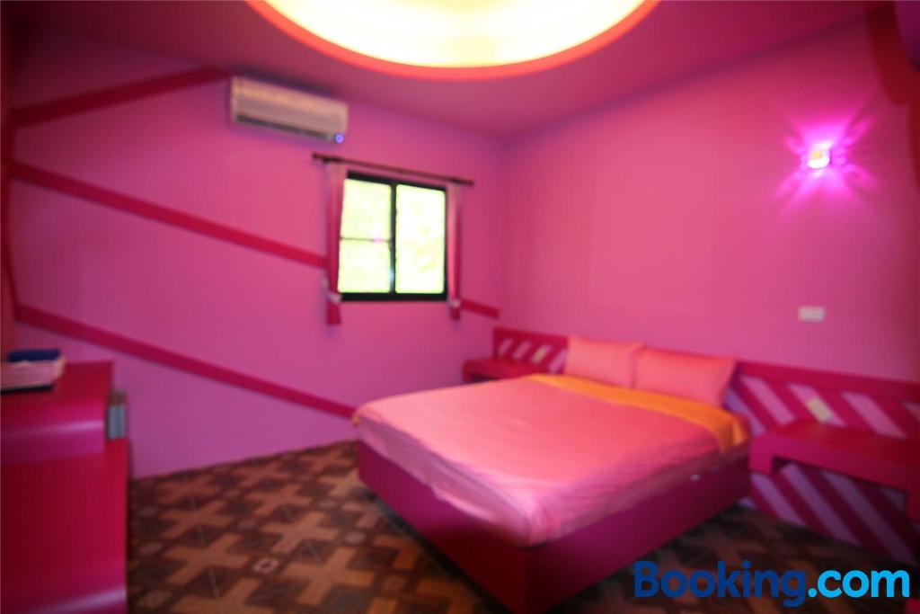 Postel nebo postele na pokoji v ubytování Lian Chinq Diving B&B