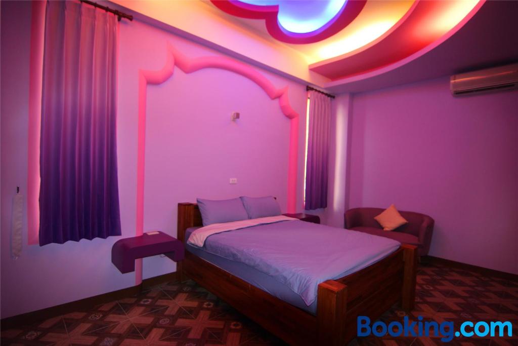 Postel nebo postele na pokoji v ubytování Lian Chinq Diving B&B
