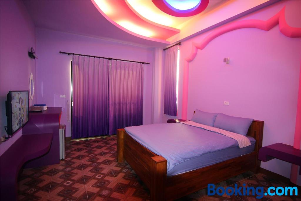Postel nebo postele na pokoji v ubytování Lian Chinq Diving B&B