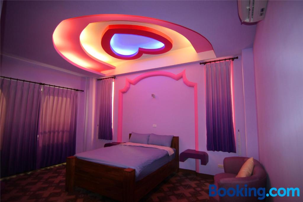 Postel nebo postele na pokoji v ubytování Lian Chinq Diving B&B