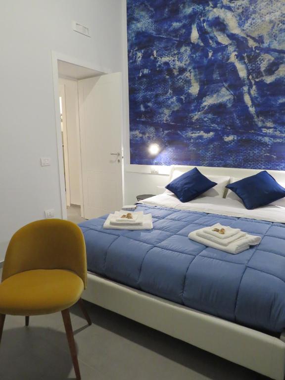 Postel nebo postele na pokoji v ubytování L'arco e il vico