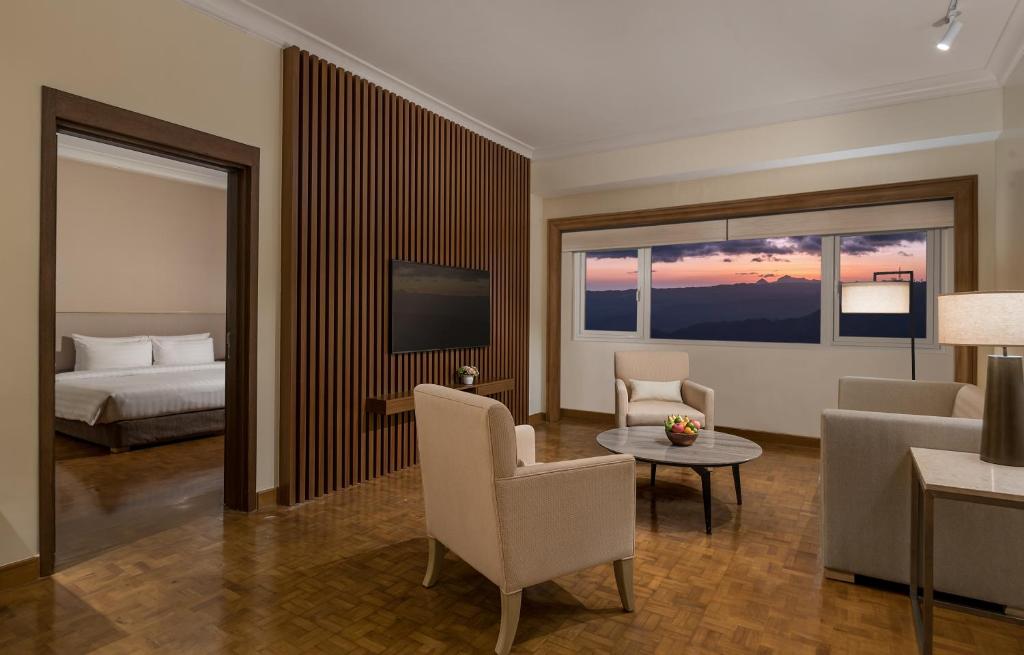 Postel nebo postele na pokoji v ubytování Taal Vista Hotel