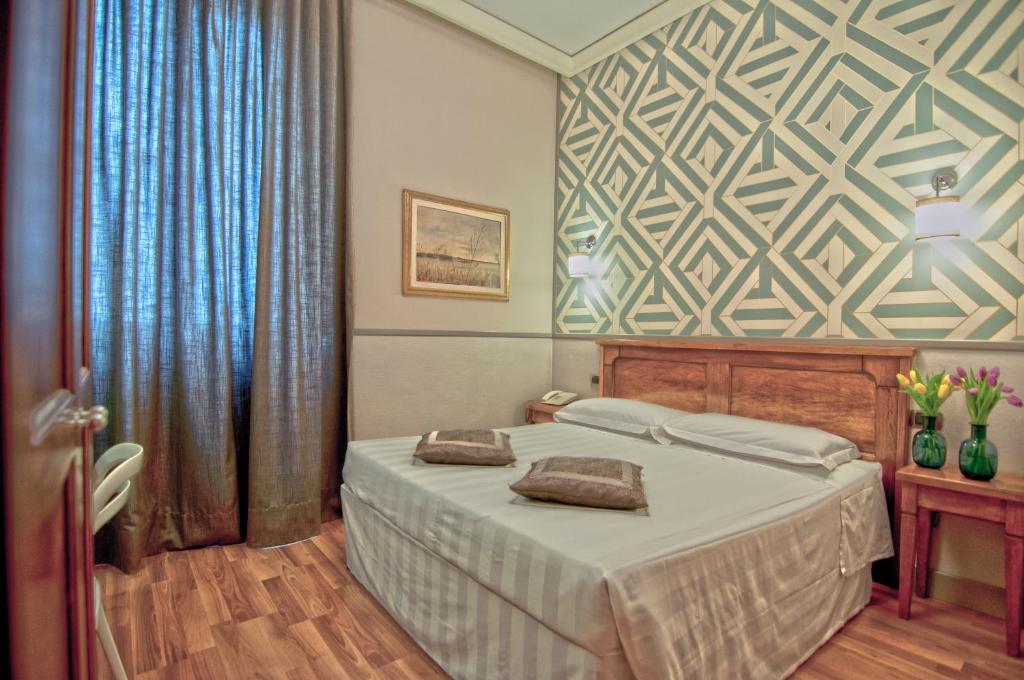 Łóżko lub łóżka w pokoju w obiekcie Hotel Golf