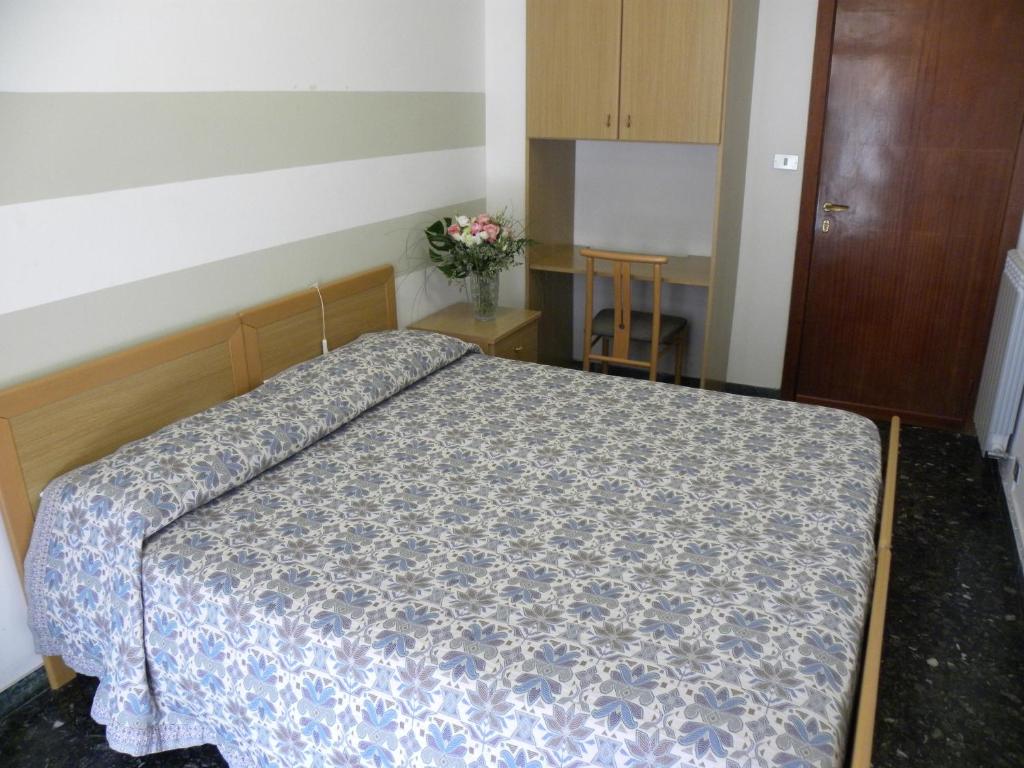 Postel nebo postele na pokoji v ubytování Albergo La Neigra