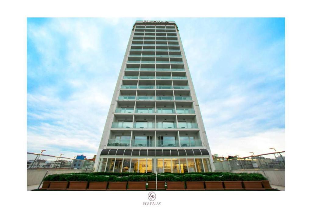 a tall building with a lot of windows at Ege Palas in İzmir