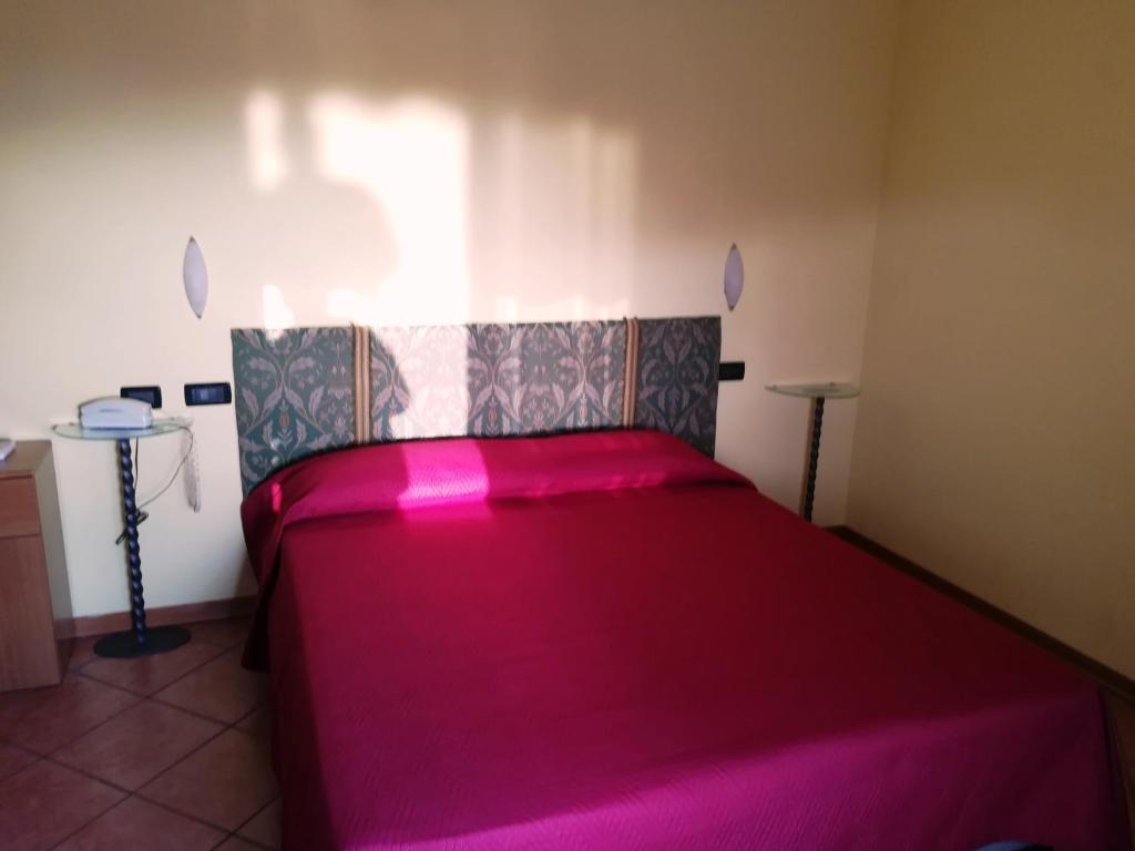 Postel nebo postele na pokoji v ubytování Hotel Villa Colombo