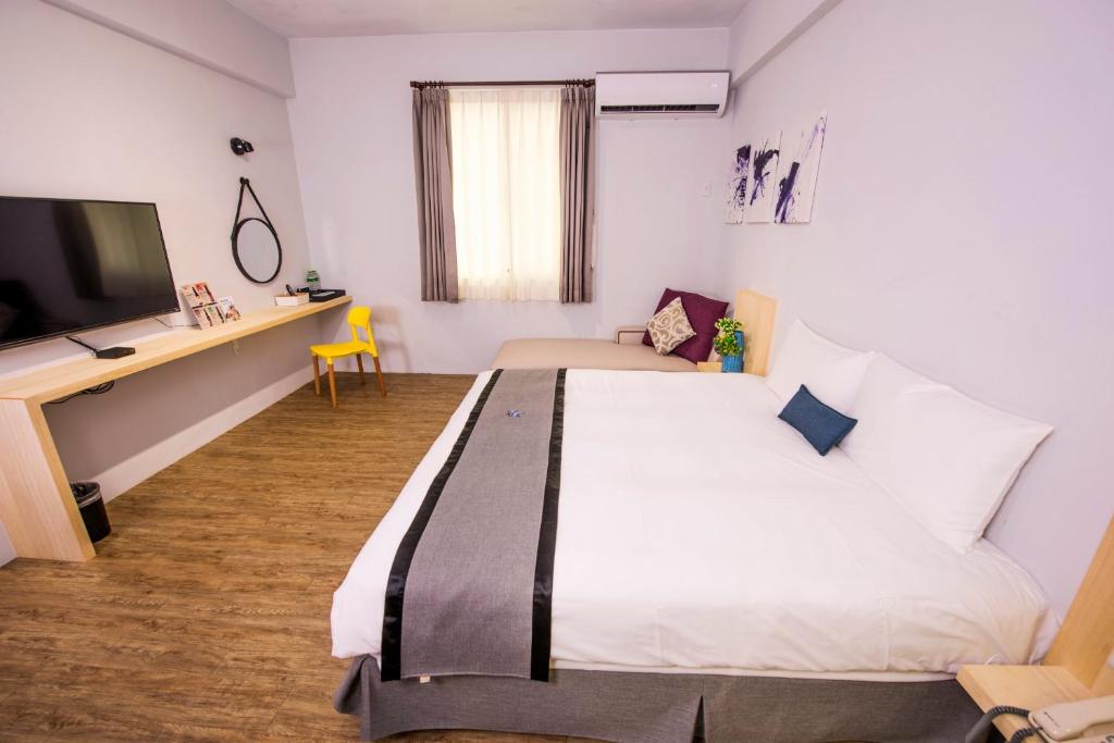 Postel nebo postele na pokoji v ubytování Youngs Hotspring Hotel
