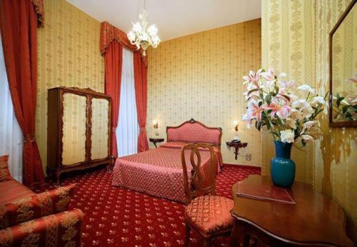 Postel nebo postele na pokoji v ubytování Centauro Hotel