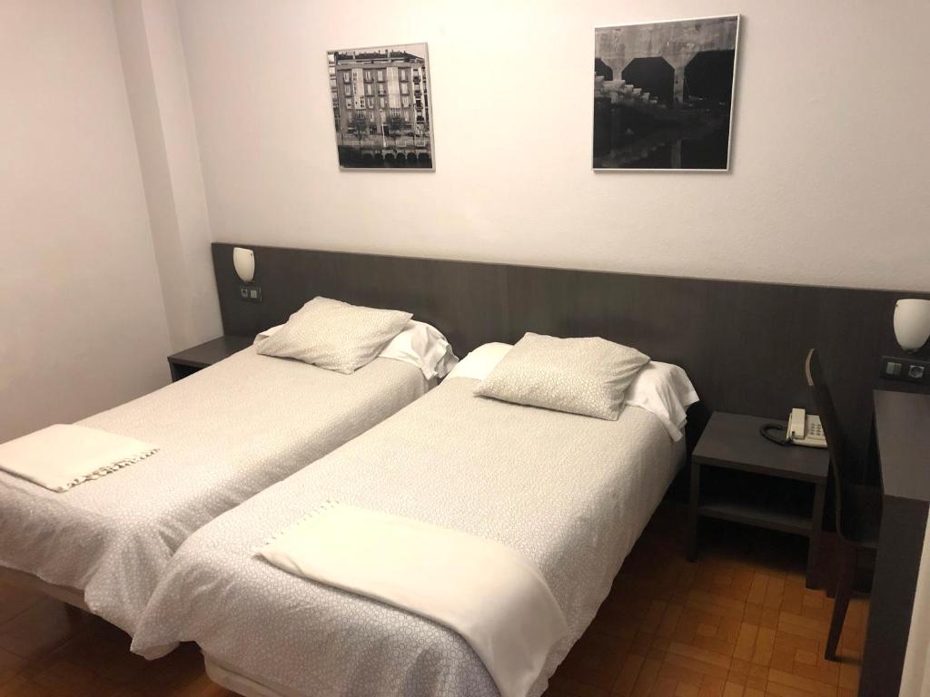 Postel nebo postele na pokoji v ubytování Hotel Ripa