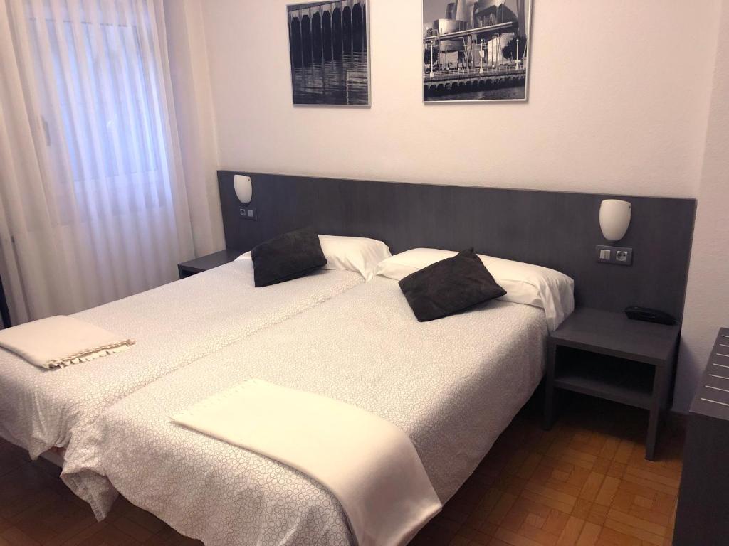 Postel nebo postele na pokoji v ubytování Hotel Ripa