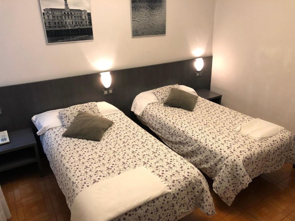 Postel nebo postele na pokoji v ubytování Hotel Ripa