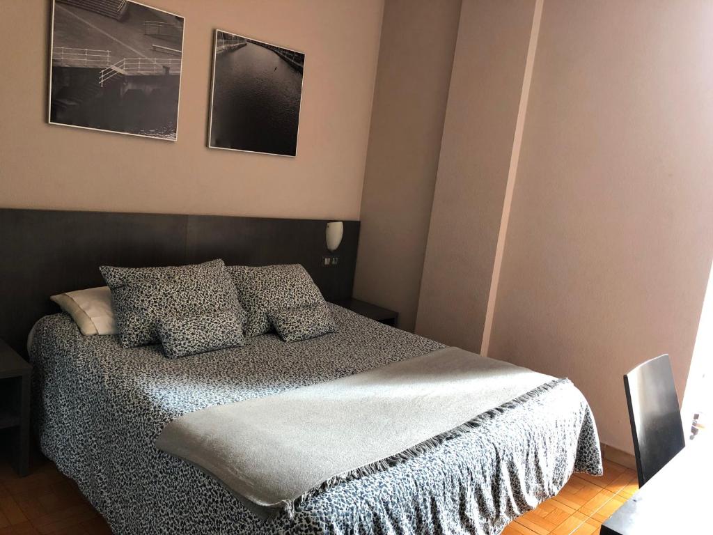 Postel nebo postele na pokoji v ubytování Hotel Ripa