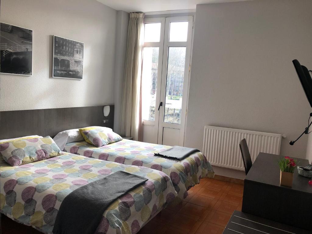 Postel nebo postele na pokoji v ubytování Hotel Ripa