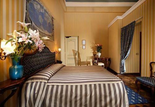 Postel nebo postele na pokoji v ubytování Centauro Hotel