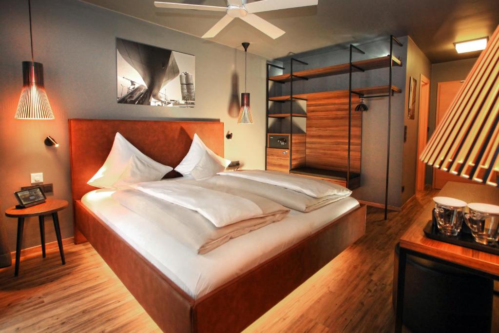 Postel nebo postele na pokoji v ubytování Bavaria Boutique Hotel