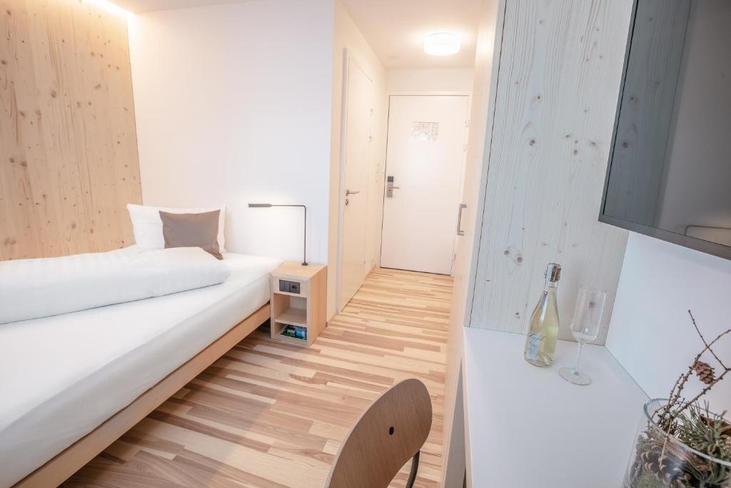 Postel nebo postele na pokoji v ubytování Hotel Seebüel