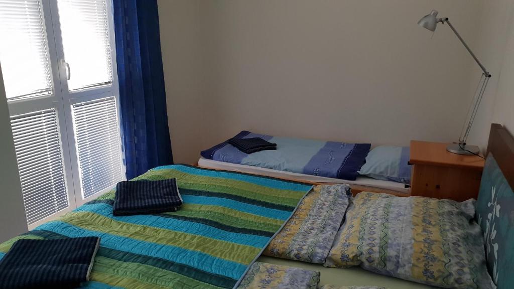 A bed or beds in a room at Apartmán Lomnica