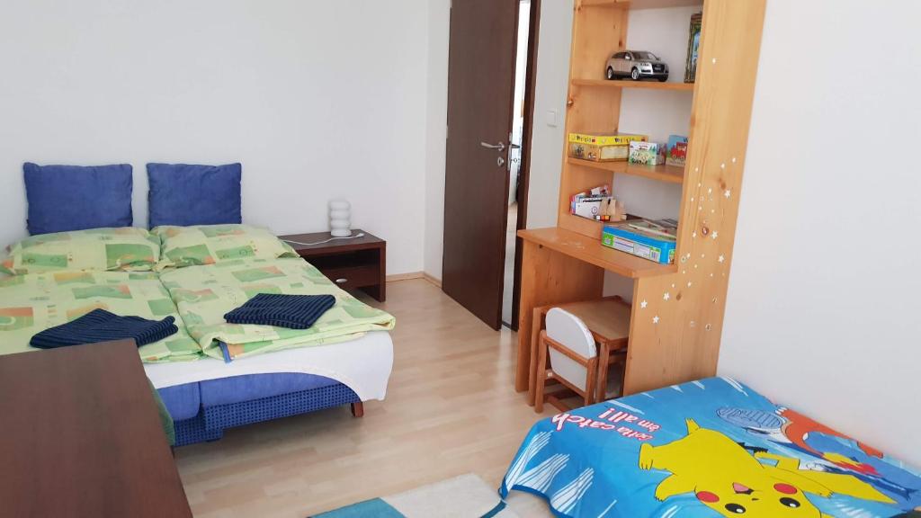 A bed or beds in a room at Apartmán Lomnica