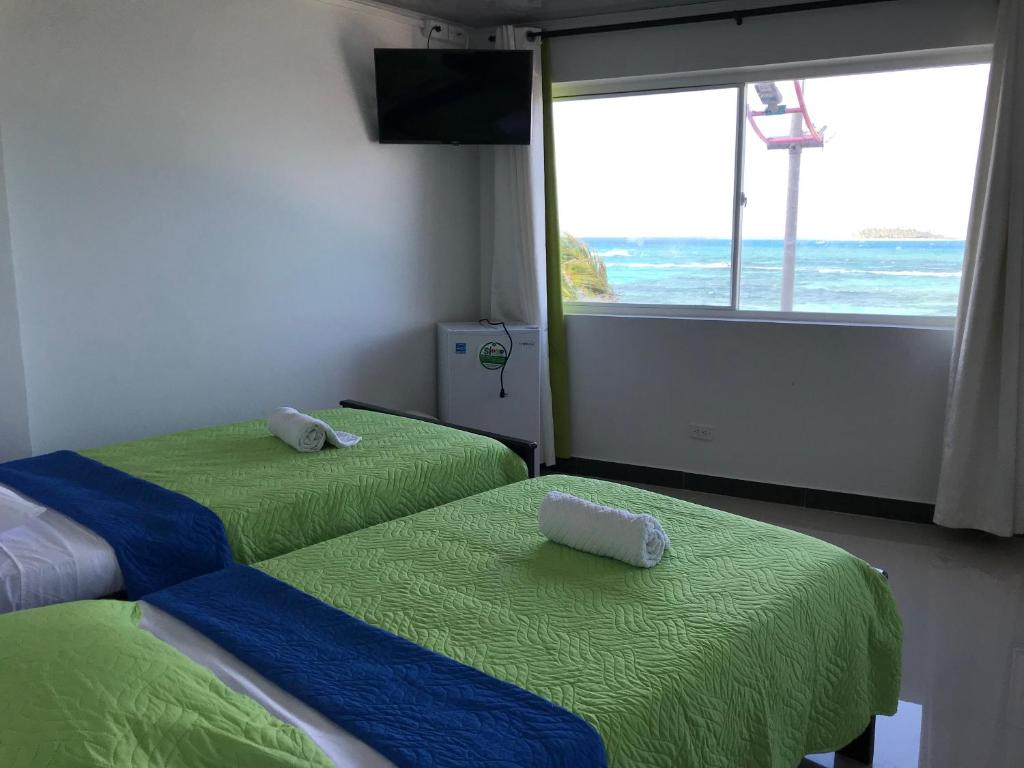 Postel nebo postele na pokoji v ubytování Alojamiento View Jhony Cay