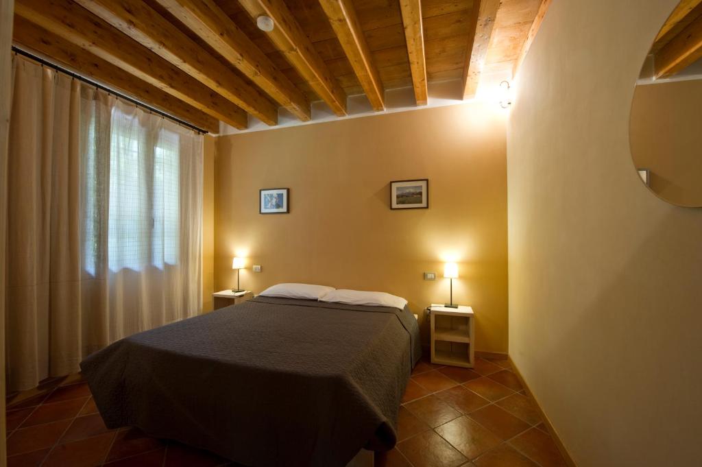 Postel nebo postele na pokoji v ubytování Borgo San Donino