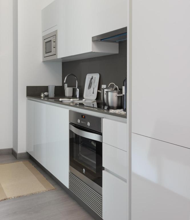 Kuchyňa alebo kuchynka v ubytovaní Apartamentos Lanceata