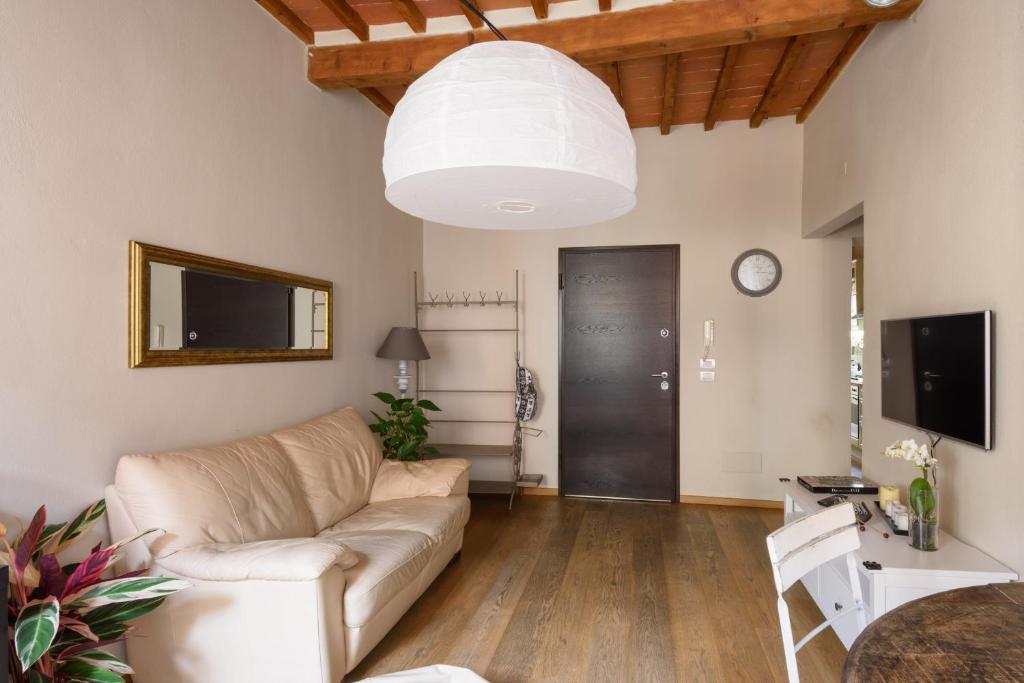 Televízia a/alebo spoločenská miestnosť v ubytovaní In Arezzo Apartment