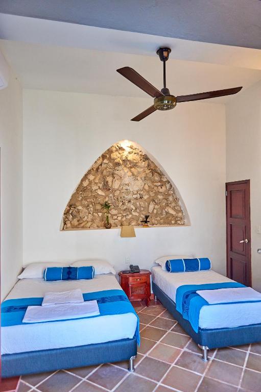 Postel nebo postele na pokoji v ubytování Cartagena Legends