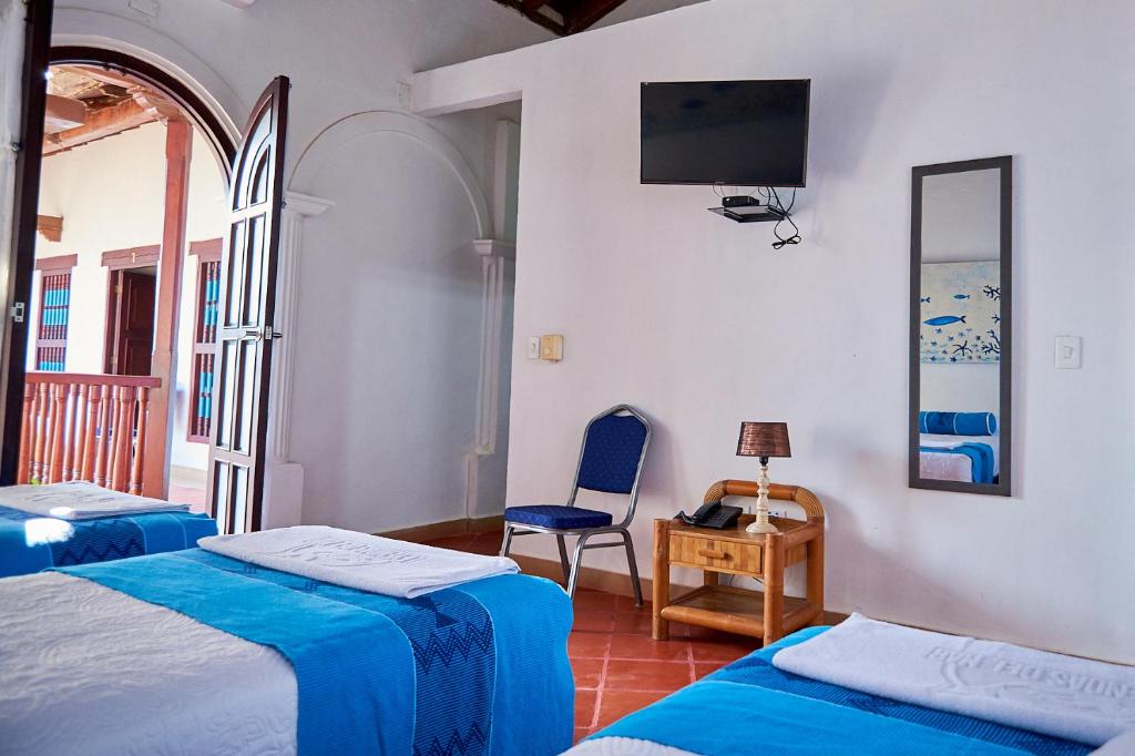 Postel nebo postele na pokoji v ubytování Cartagena Legends