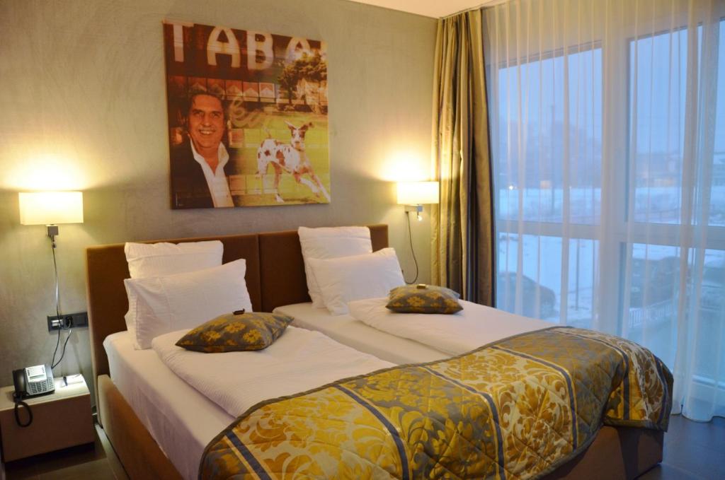Postel nebo postele na pokoji v ubytování Hotel Swiss Star