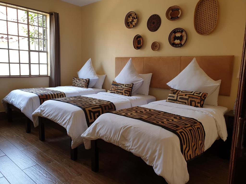 Postel nebo postele na pokoji v ubytování Acacia Tree Lodge