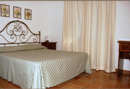 Postel nebo postele na pokoji v ubytování Albergo Belvedere