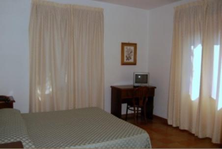 Postel nebo postele na pokoji v ubytování Albergo Belvedere