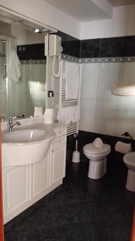 Koupelna v ubytování Hotel Esperia