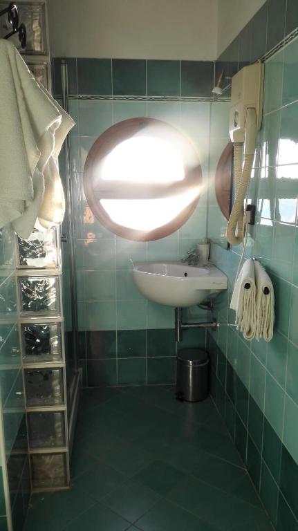 Koupelna v ubytování Hotel Esperia
