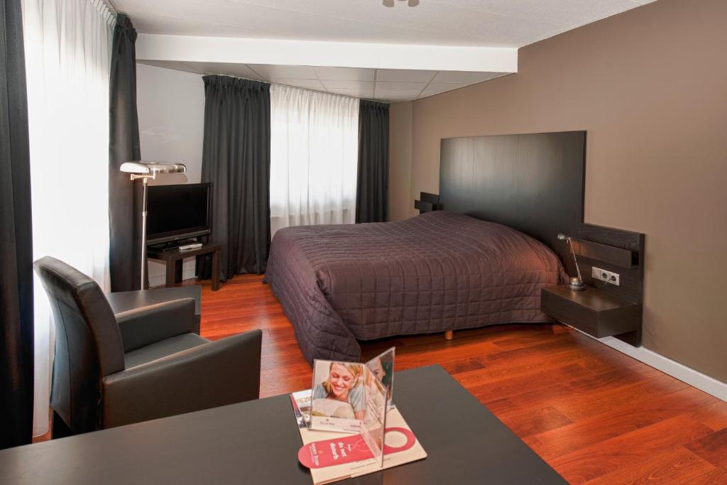Cama o camas de una habitación en City Hotel Bergen op Zoom