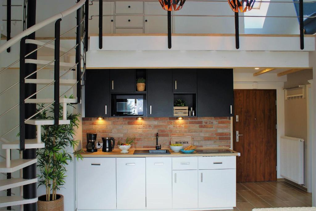 Kuchyňa alebo kuchynka v ubytovaní Apartament Comfort