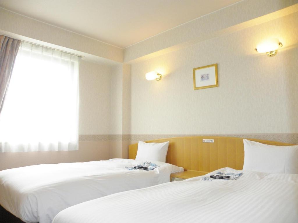 Giường trong phòng chung tại Yonezawa - Hotel / Vacation STAY 14344