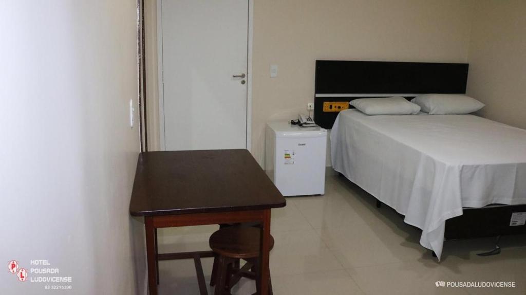 Postel nebo postele na pokoji v ubytování Hotel Pousada Ludovicense
