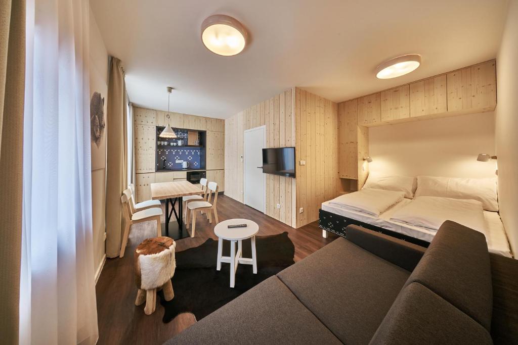 TV a/nebo společenská místnost v ubytování Aparthotel Svatý Vavřinec