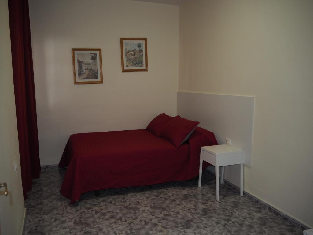 A bed or beds in a room at apartamentos la villa 2
