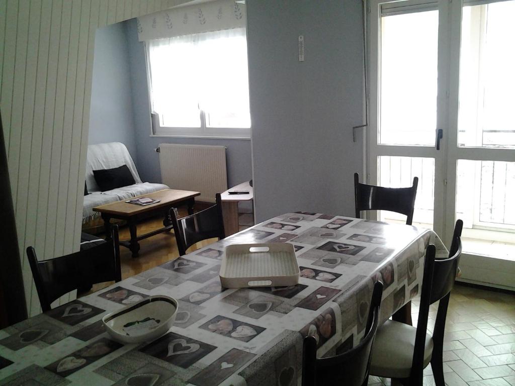 a room with a table with a table cloth on it at La montagne in La Bresse