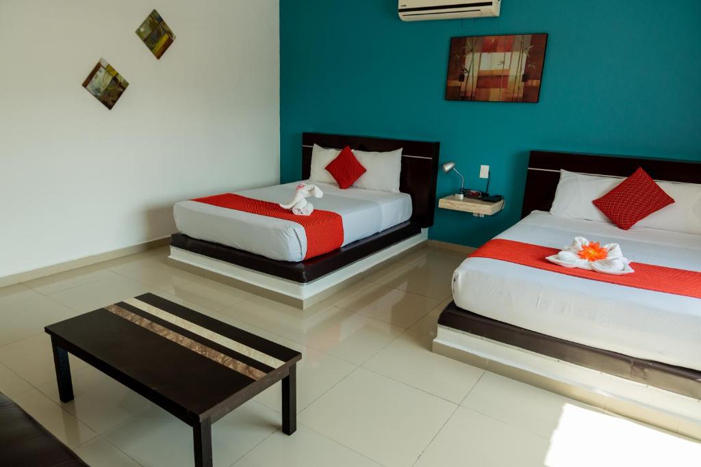Postel nebo postele na pokoji v ubytování Hotel Playa Encantada