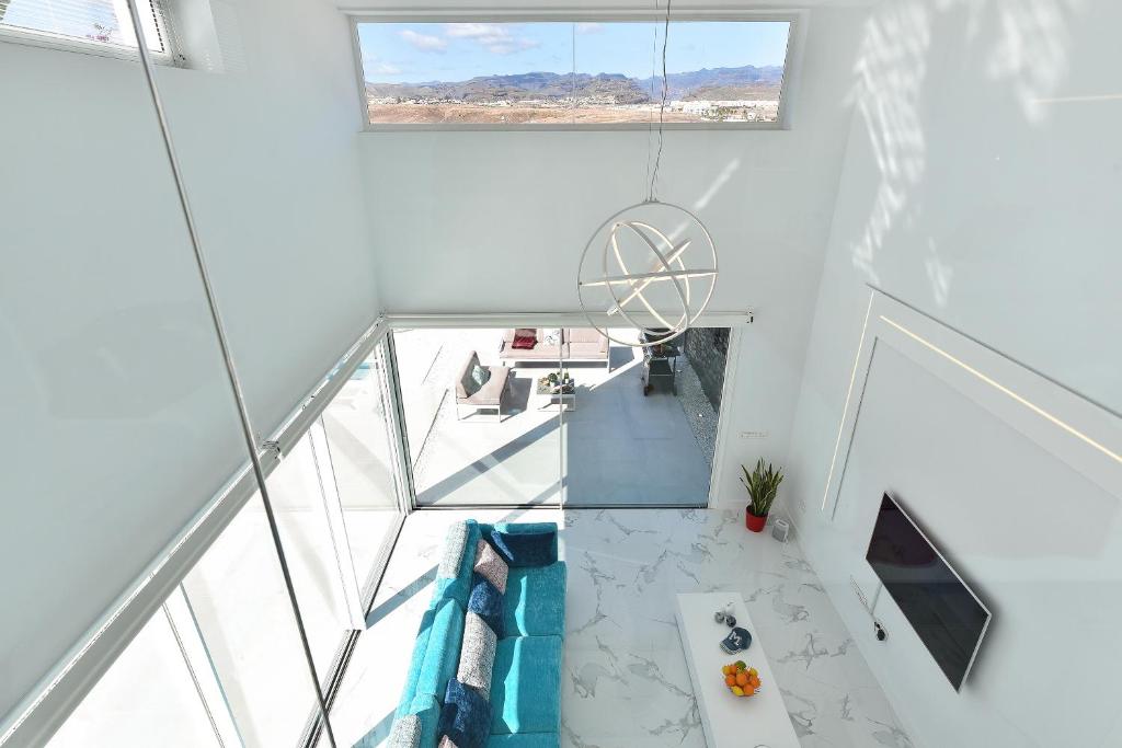 Televízia a/alebo spoločenská miestnosť v ubytovaní Villas Golden by Sun Houses Canarias